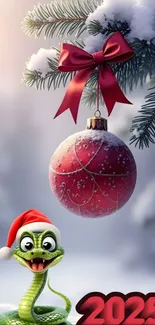 Playful snake in Santa hat with ornament in snowy pine branches for 2025.