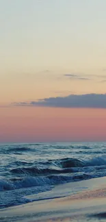 Serene ocean waves at sunset with a twilight sky on mobile wallpaper.