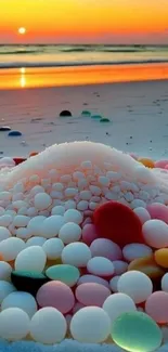 Sunset beach with colorful pebbles on sand.